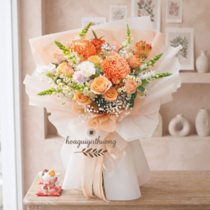 Bó hoa tươi handmade tone cam vàng nổi bật, được thiết kế tại shop hoa tươi handmade Hoa Gửi Yêu Thương – lựa chọn tinh tế cho mọi dịp tặng hoa.
